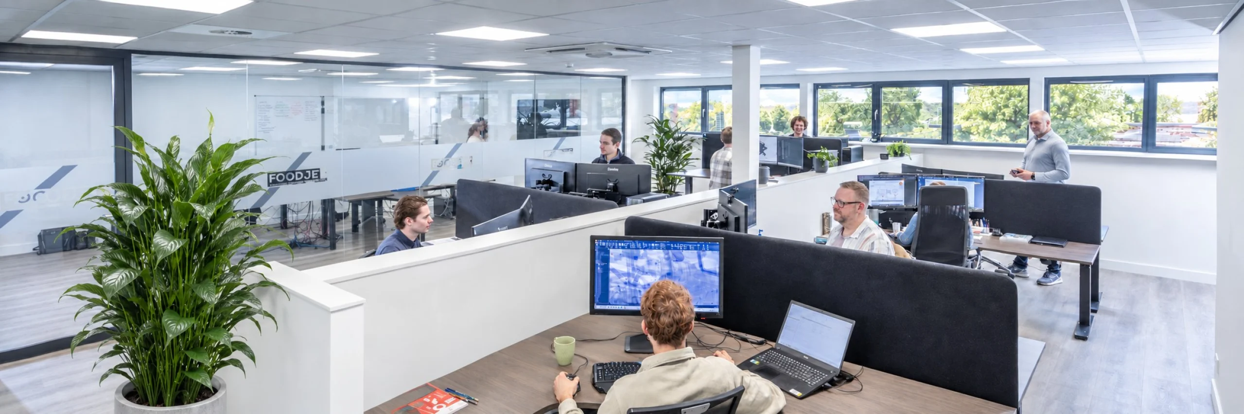 FoodJet engineering office with colleagues working at desks with CAD screens